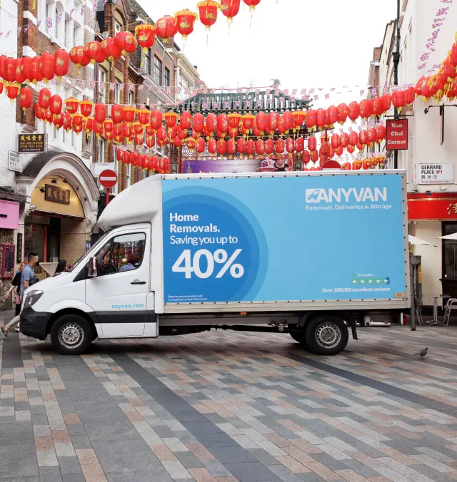 Luton van wrapped in Anyvan livery in front of red lanterns in Chinatown London